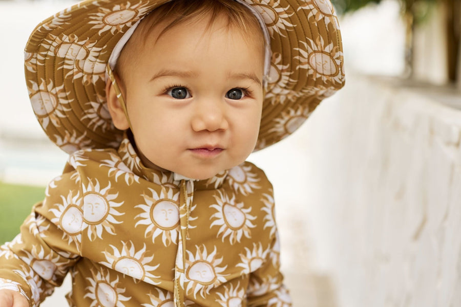 How to dress your little one for a day at the beach this summer